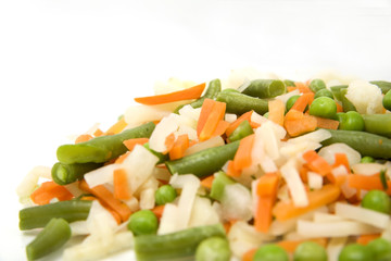 Frozen mixed vegetables in isolated white background