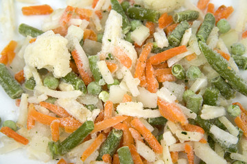Frozen mixed vegetables in isolated white background