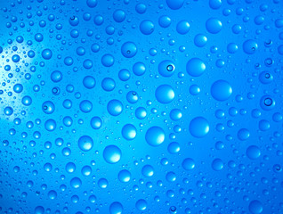 water drops over blue background
