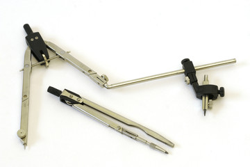 two compasses on white