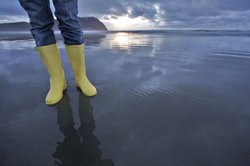 Woman Wearing Yellow Boots at Beach