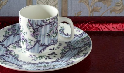 England old style tea cup and dish over red tray