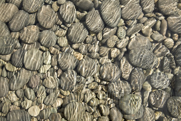 Fototapeta na wymiar Pebbles in Stream Background/Texture