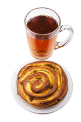 a cup of black tea with a cinnamon and rasins rolled bun