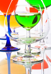 abstract composition with wine glasses with coloured liquids