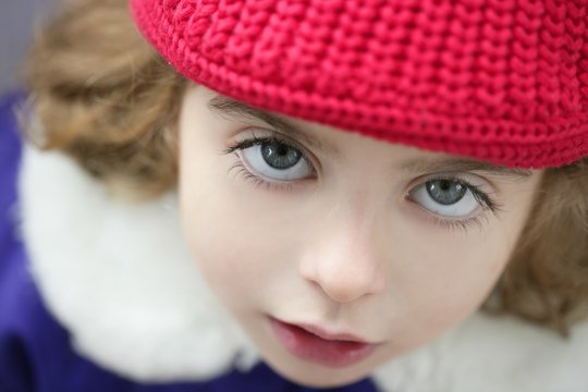 beautiful toddler girl winter hat portrait outdoors