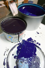 Offset paints (inks) in cans with brushes in publishing house