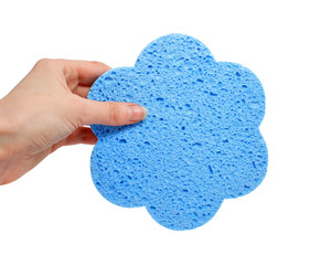 blue bath sponge in the hand isolated