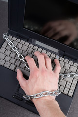 Laptop and a hand