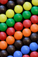 colorful candy in diagonal rows on black