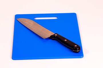 Santoku Knife on Blue Cutting Board