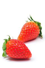two strawberries isolated in white background