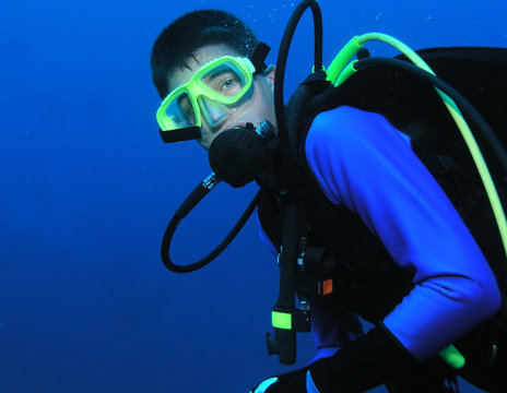 Scuba Diver Geared Up In Profile