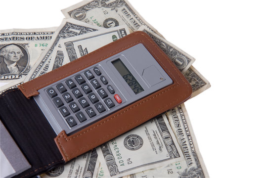american money with notepad and calculator