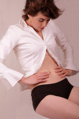 young woman is checking her tummy