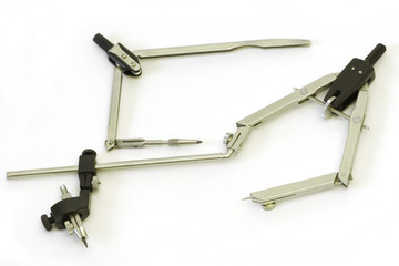 two compasses on white