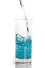 Glass of pouring water with reflection