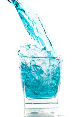 Glass of pouring water with reflection