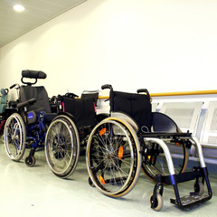 wheel chairs parked in a hospital corridor