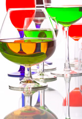 abstract composition with wine glasses with coloured liquids