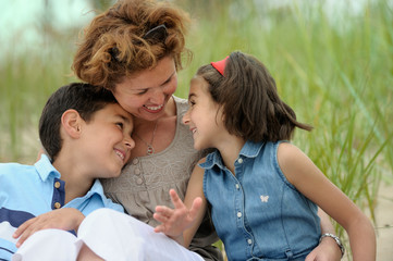 Happy mother and kids outdoors