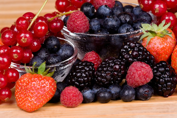 Wild fruits redcurrant, blackberry, raspberry and blueberry