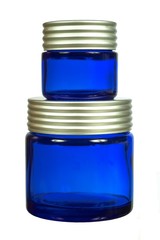 Two creme jars isolated on white background