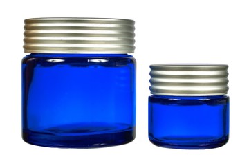 Two creme jars isolated on white background