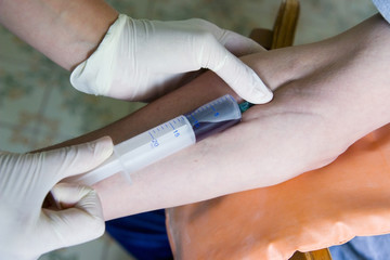 close up of blood extraction in laboratory