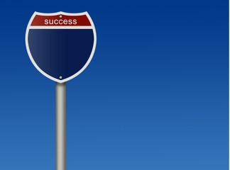 Road sign against blue sky