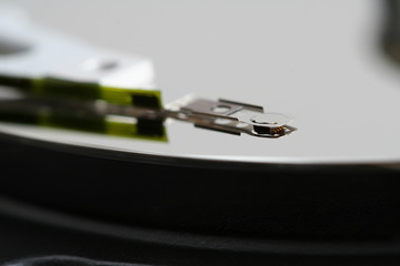 Inner workings of a computer hard disk: magnetic head.