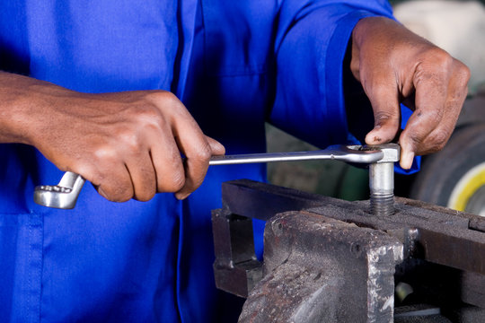 man working with spanner