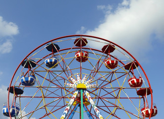 Carousel on the summer sky background