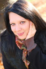 Beautiful woman in the autumn park