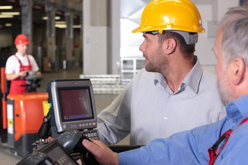 supervisor and workers in warehouse