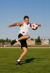kicking a soccer ball