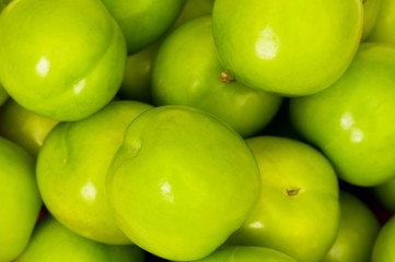 Green apples arranged on the market stand