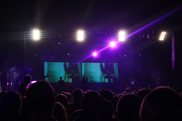 Fototapeta na wymiar Concert lights on dark stage