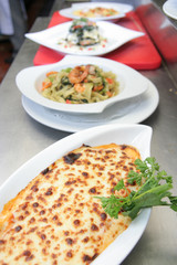 baked lasagna and fettucine