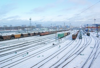 Freight wagons under snow on winter cargo terminal