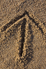 arrow sign in sand