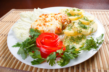 meat with potatoes and vegetable.