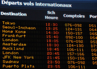Canadian airport information board, international departures,