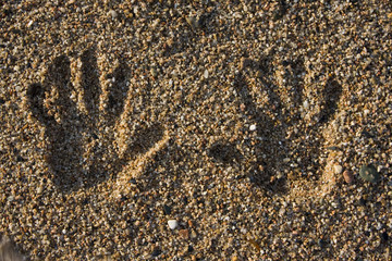 hand print on the beach