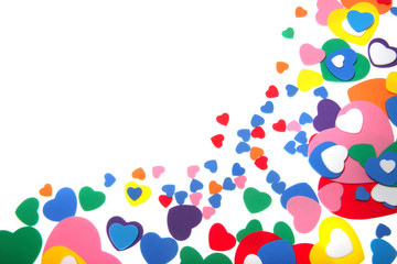 colorful foam confetti hearts over white background