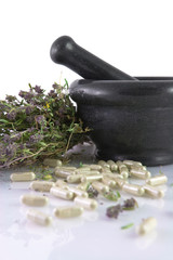 Ceramic mortar, thyme and herbal pills