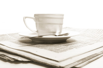 Cup  coffee on a morning paper business news