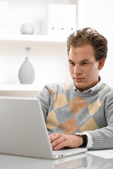 Young man using laptop