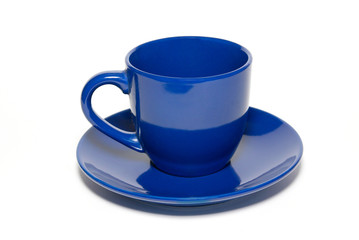 Blue ceramic cup and saucer isolated on white.