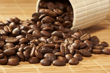 Cup with coffee, costing on coffee grain